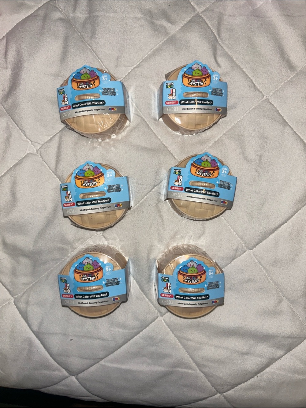 Surprise Mystery Squishy in hard case Beige with Blue Labels (6 Pack)